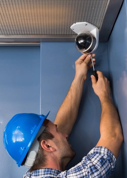 technician installing cctv